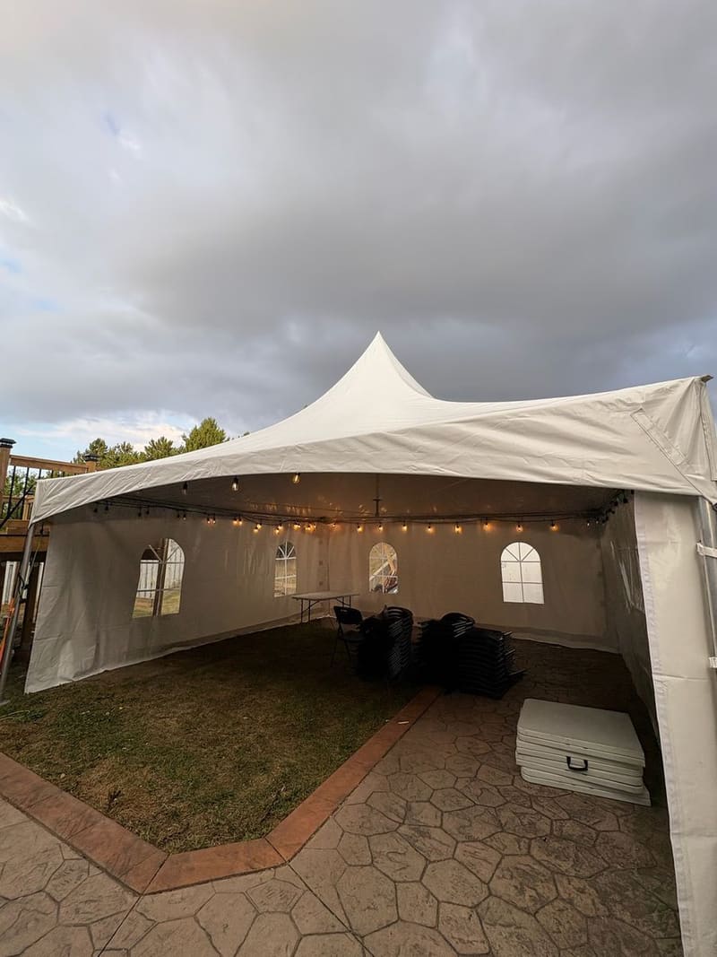 Skytop tent with sidewalls installed on a patio for an outdoor corporate function