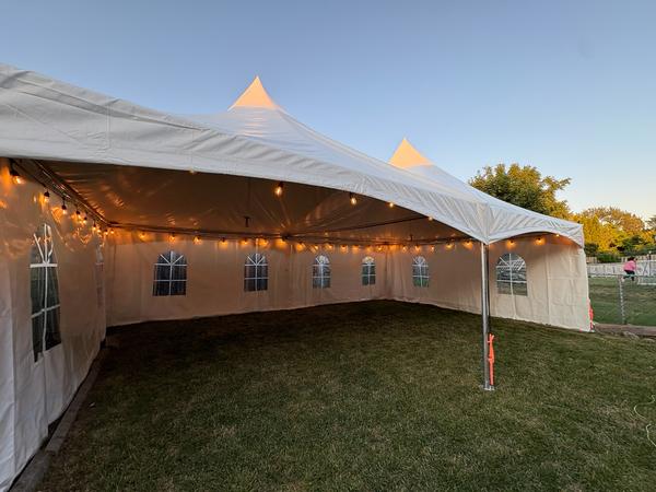 Skytop tent with string lights at golden hour
