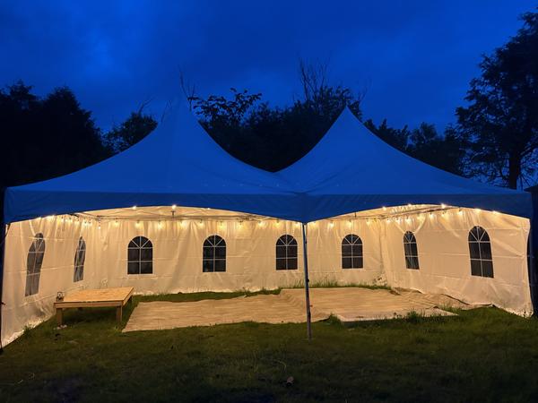 Long Skytop tent glowing warmly at night