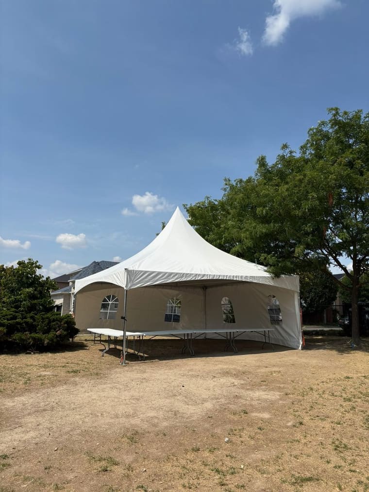 Skytop frame tent installed on a gravel commercial lot